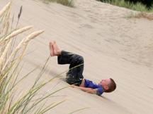 Kyle playing in sand